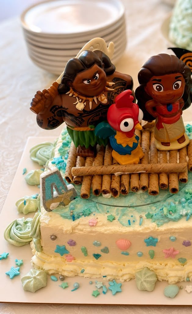 Moana and Maui themed beach birthday cake with ocean-blue buttercream and seashell sprinkles — custom kids' celebration cake by Sienne's Table, Lomita CA